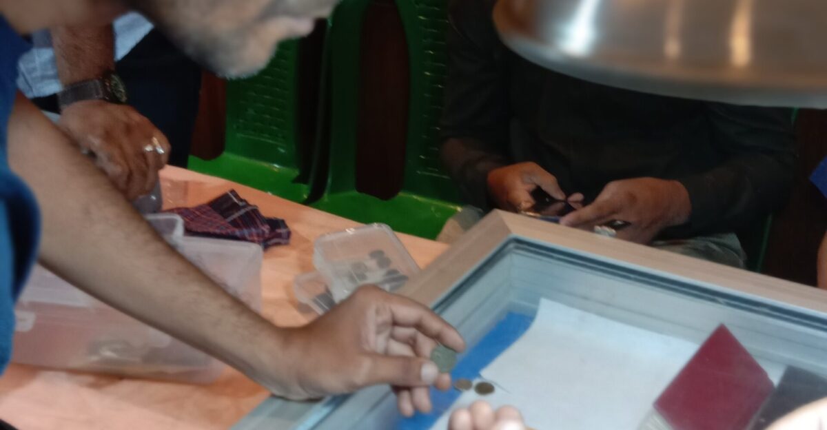 A coin collector at an exhibition organized by the Numismatic Society of Calcutta in Ballygunge Kolkata West Bengal Photo taken by Yogabrata Chakraborty on July 23 2022