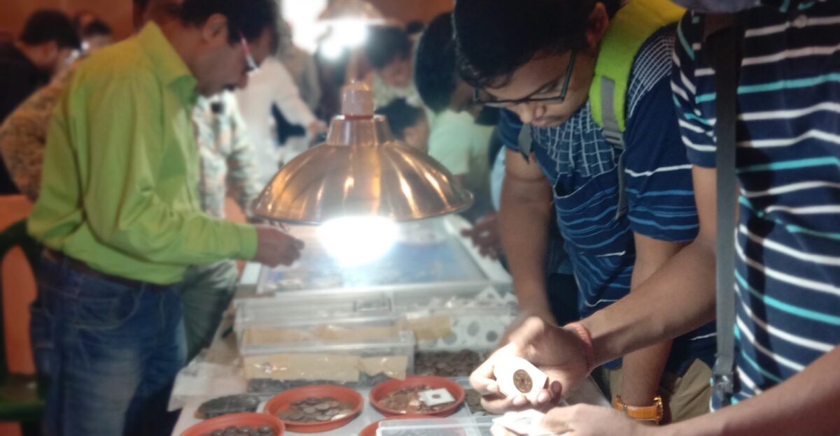 Coin collectors and enthusiasts enjoying the taste of numismatic items at an exhibition organized by the Numismatic Society of Calcutta in Ballygunge Kolkata West Bengal Photo taken by Yogabrata Chakraborty on July 23 2022