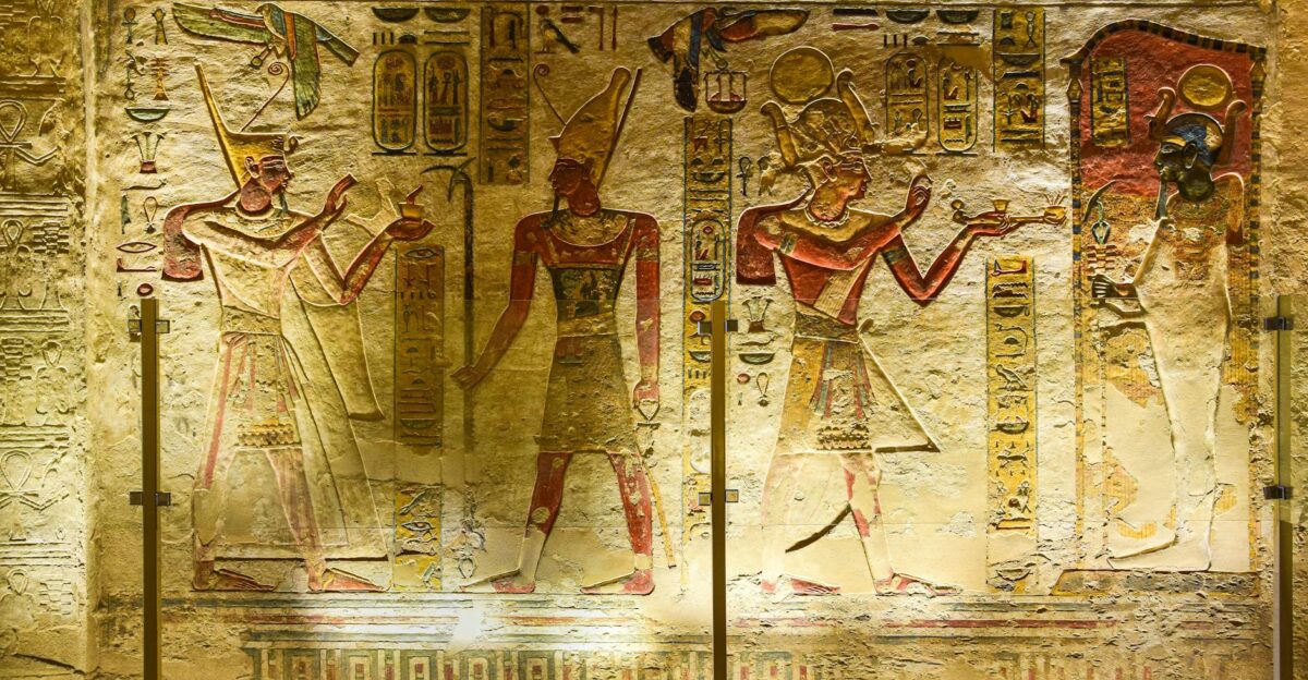 Intricate ancient Egyptian wall reliefs with hieroglyphs and figures