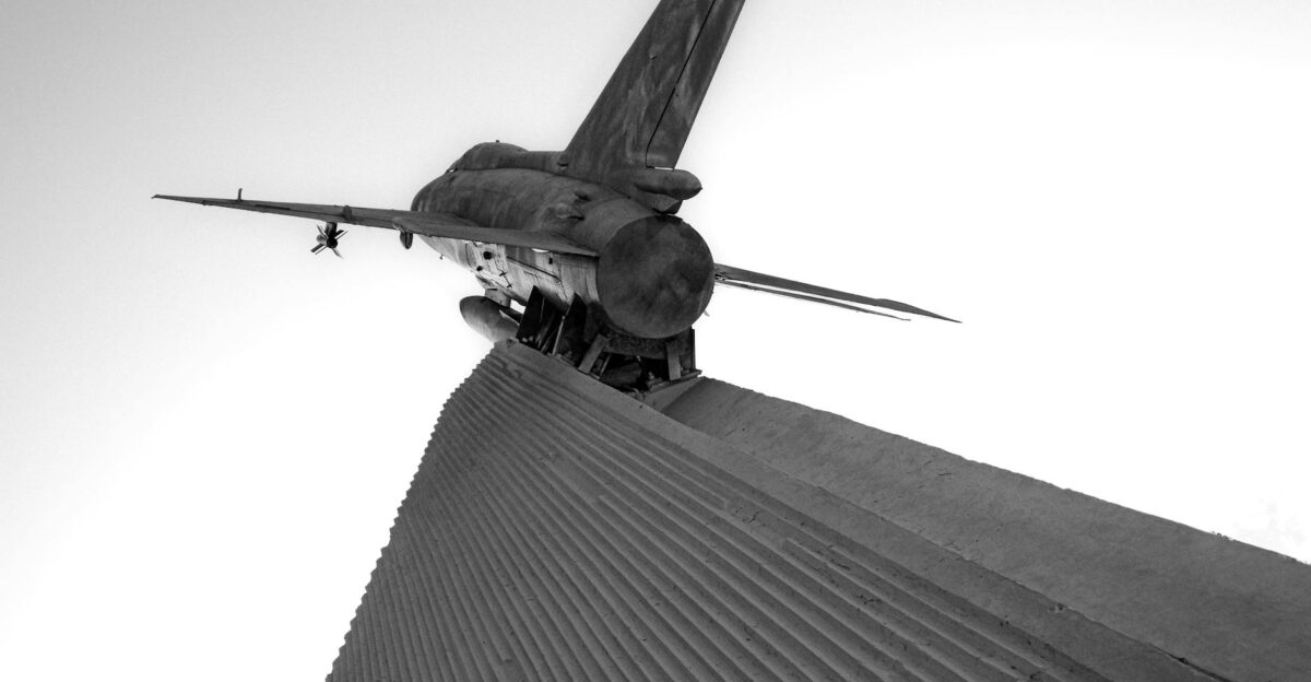 Black and white image of a jet plane sculpture in Aktau Kazakhstan Stark monochrome tones