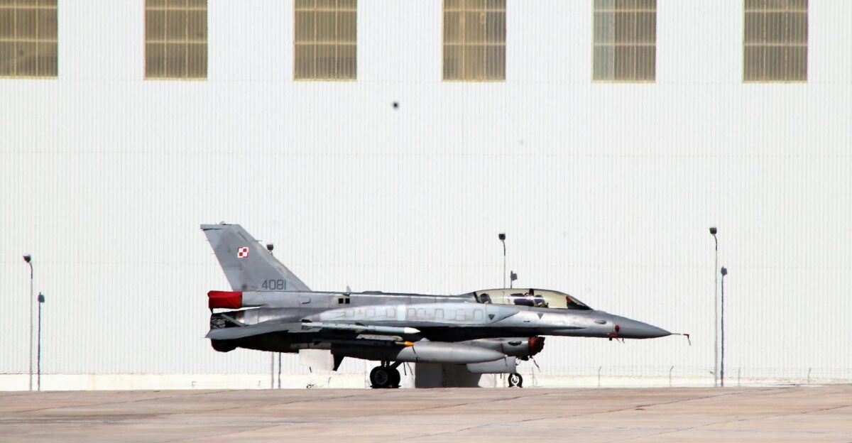 A Polish Air Force F-16 fighter jet parked outside a hangar in Luqa Malta