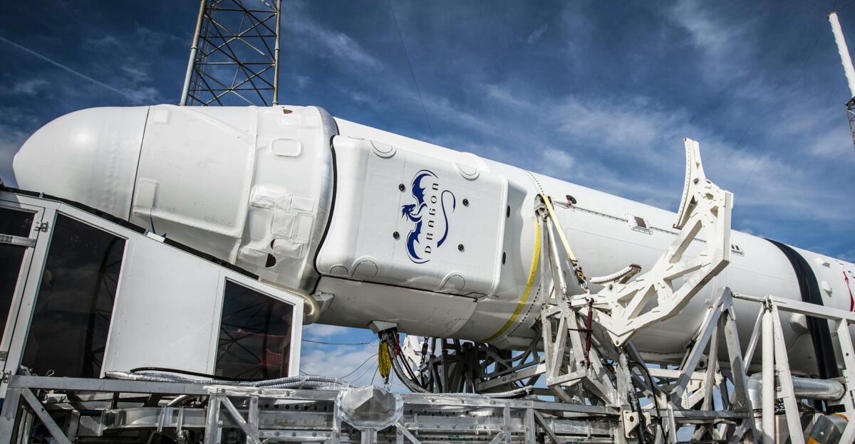 Low angle of solid rocket booster placed on industrial machine platform for transportation and installation against blue sky