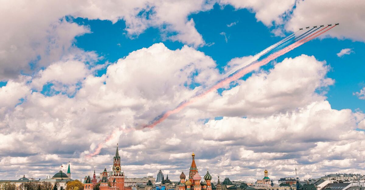 Stunning aerial view of Moscow s Red Square with jets in formation against a vibrant sky