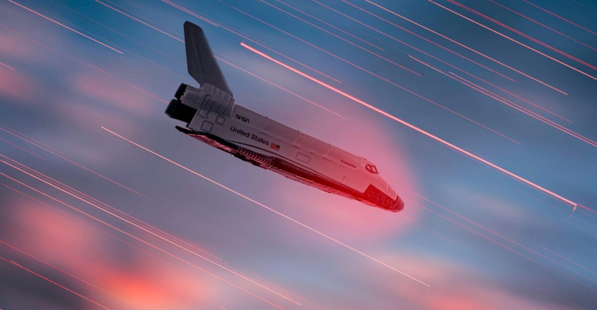 an airplane is flying in the sky at sunset