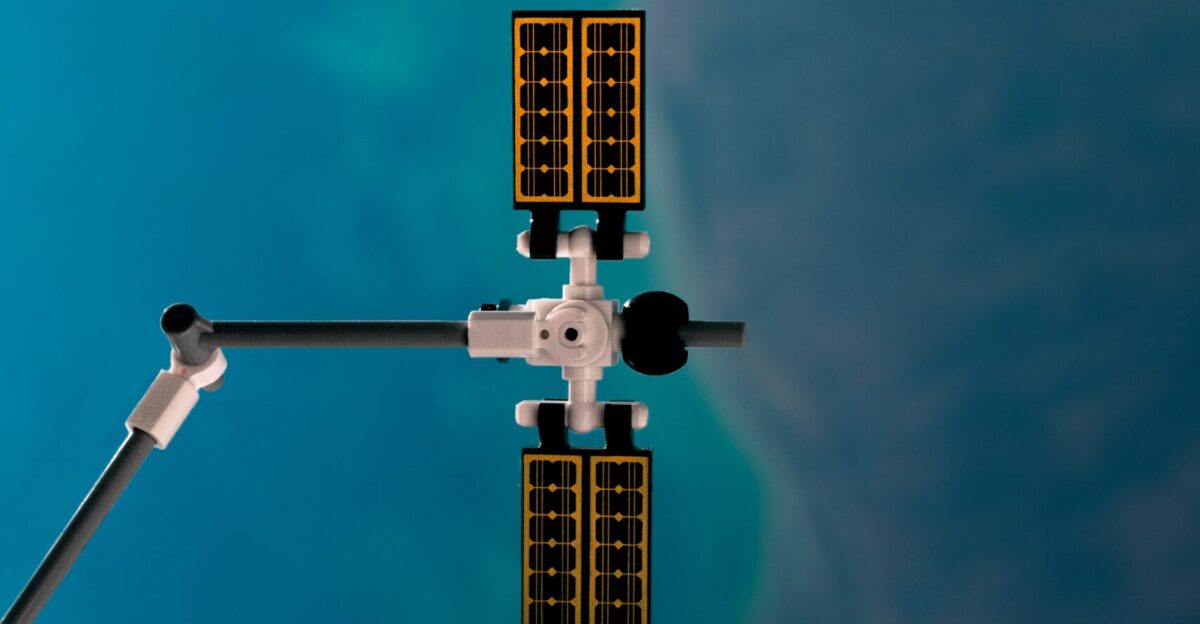 a space shuttle flying over a body of water