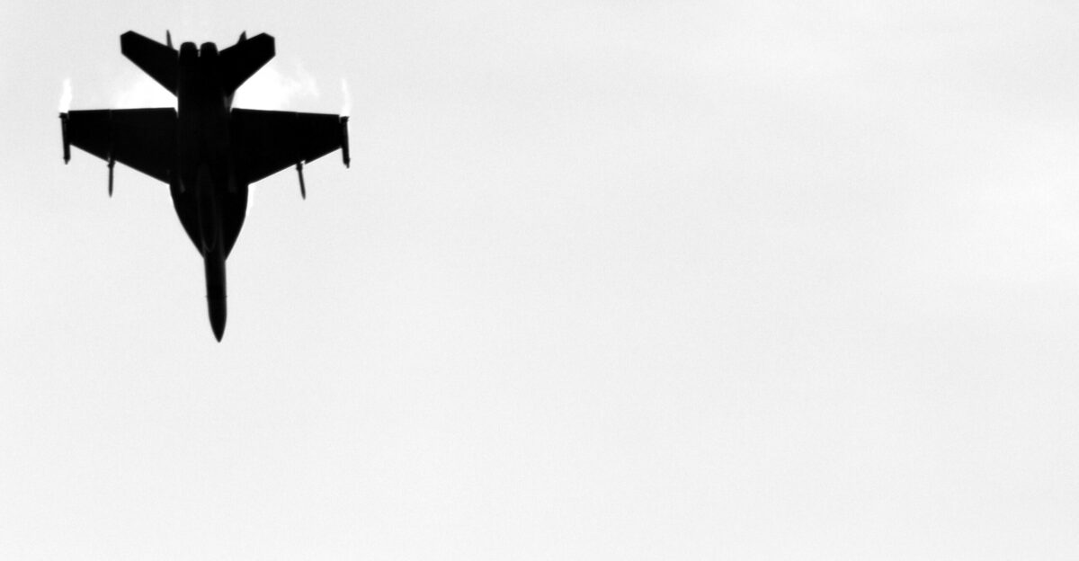 a black and white photo of a fighter jet