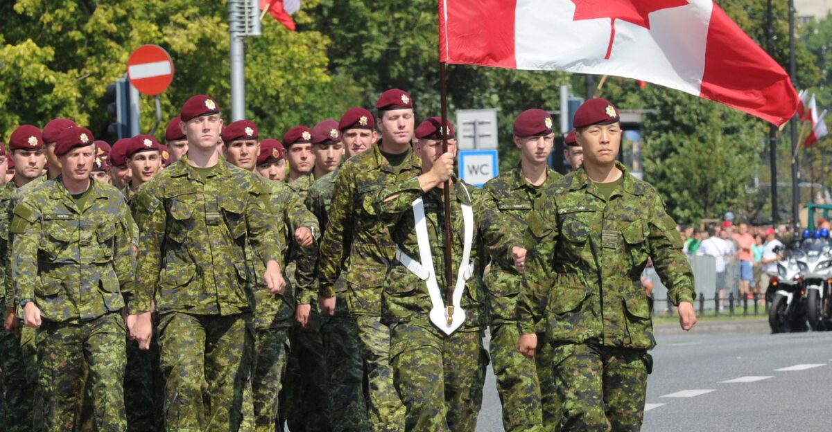 A military unit from Canada marches during a military parade marking Polish Armed Forces Day in Warsaw Poland Friday Aug 15 2014 by Paul Lanquist