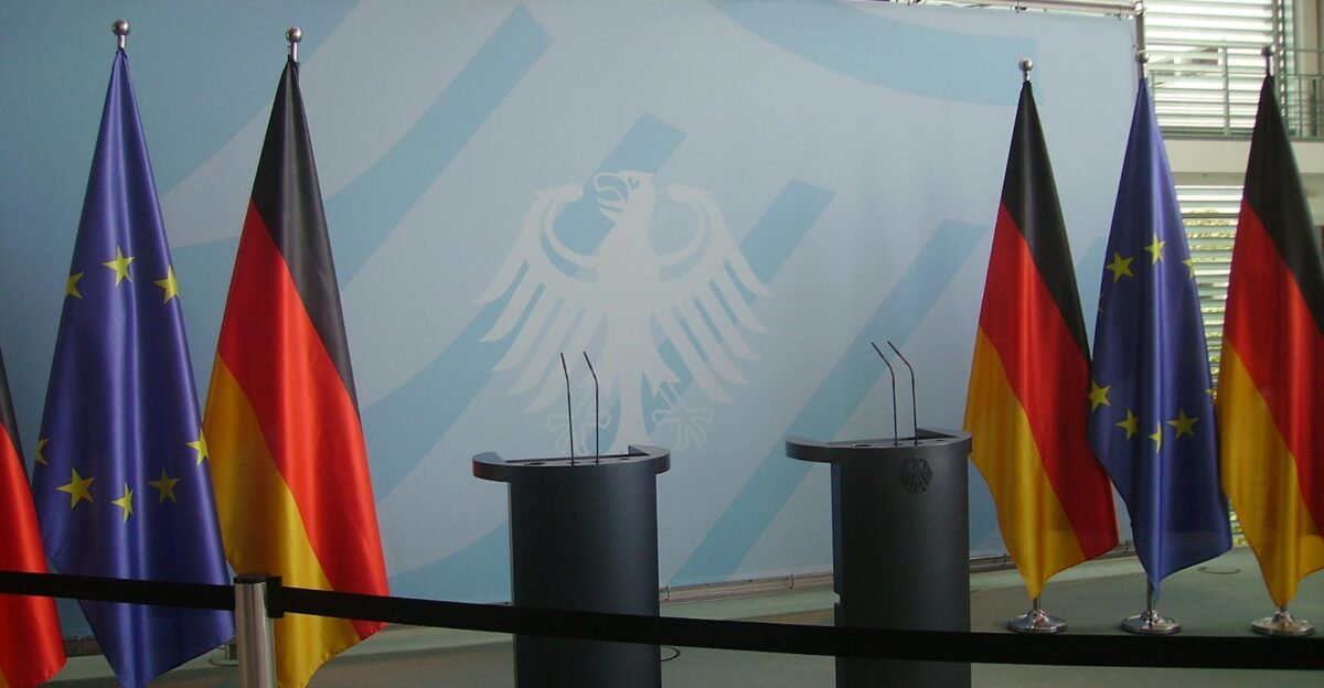 Empty podiums with German and EU flags in Federal Chancellery Berlin