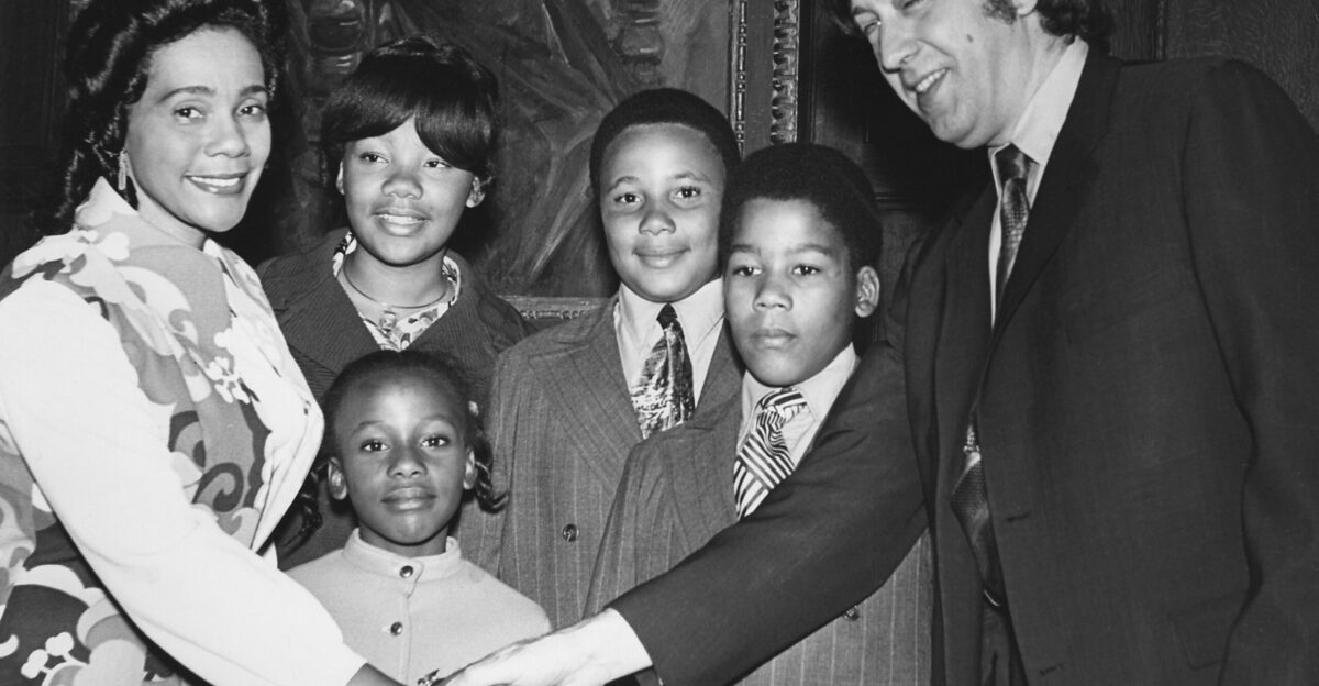 Coretta Scott King NEC alumna and widow of Dr Martin Luther King Jr accompanied by her children shakes hands with NEC President Gunther Schuller in Jordan Hall May 1971 On this occasion Ms King delivered the Conservatory s Commencement address and received an honorary degree Photographer Frederick Clow NEC Archives