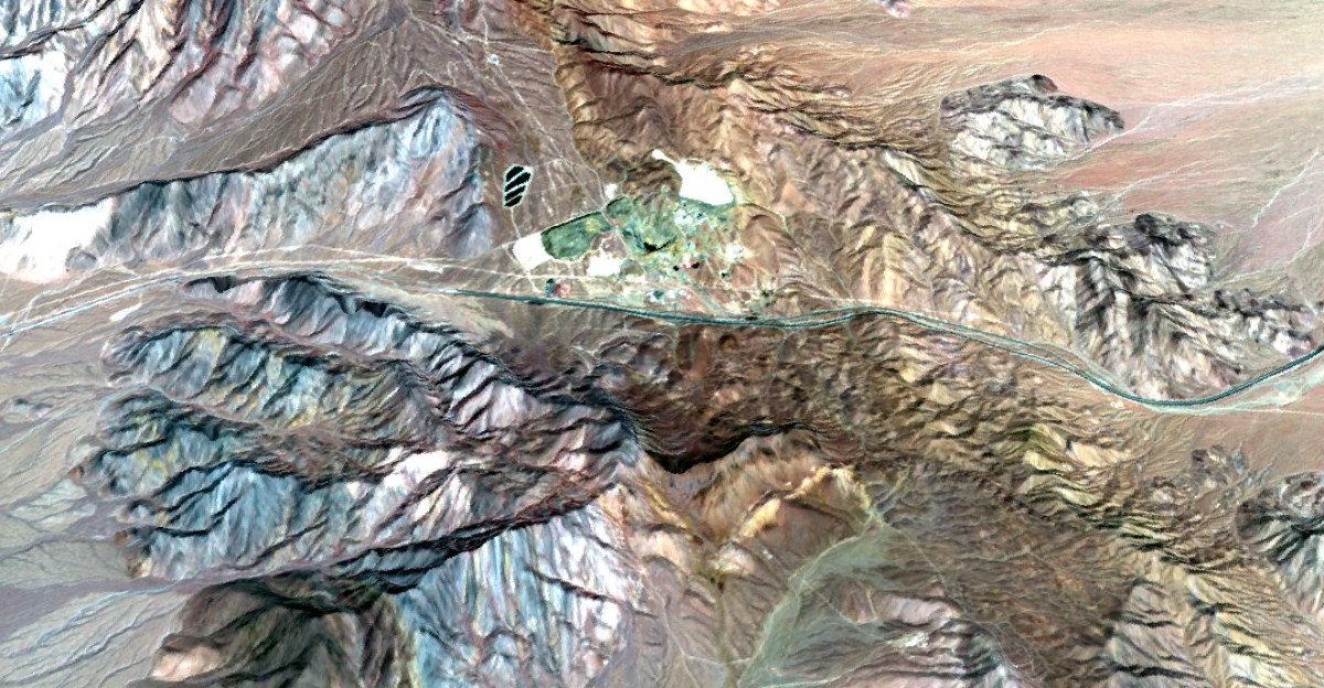 The Mountain Pass rare earth mine is an open-pit mine of rare earth elements REEs in southeastern California near the Nevada border REEs are vital for the electronics industry auto manufacturing and a wide range of other high-tech products The mine once supplied most of the world s rare earth elements until its closure in 2002 Since then China has taken over as the leading supplier of REEs producing over 96 of the world s supply In 2008 Mountain Pass was purchased by a new operator who plans to produce 20-25 of the world s REEs by 2014 The image was acquired March 28 2010 covers an area of 17 3 x 18 5 km and is located at 35 5 degrees north latitude 115 5 degrees west longitude