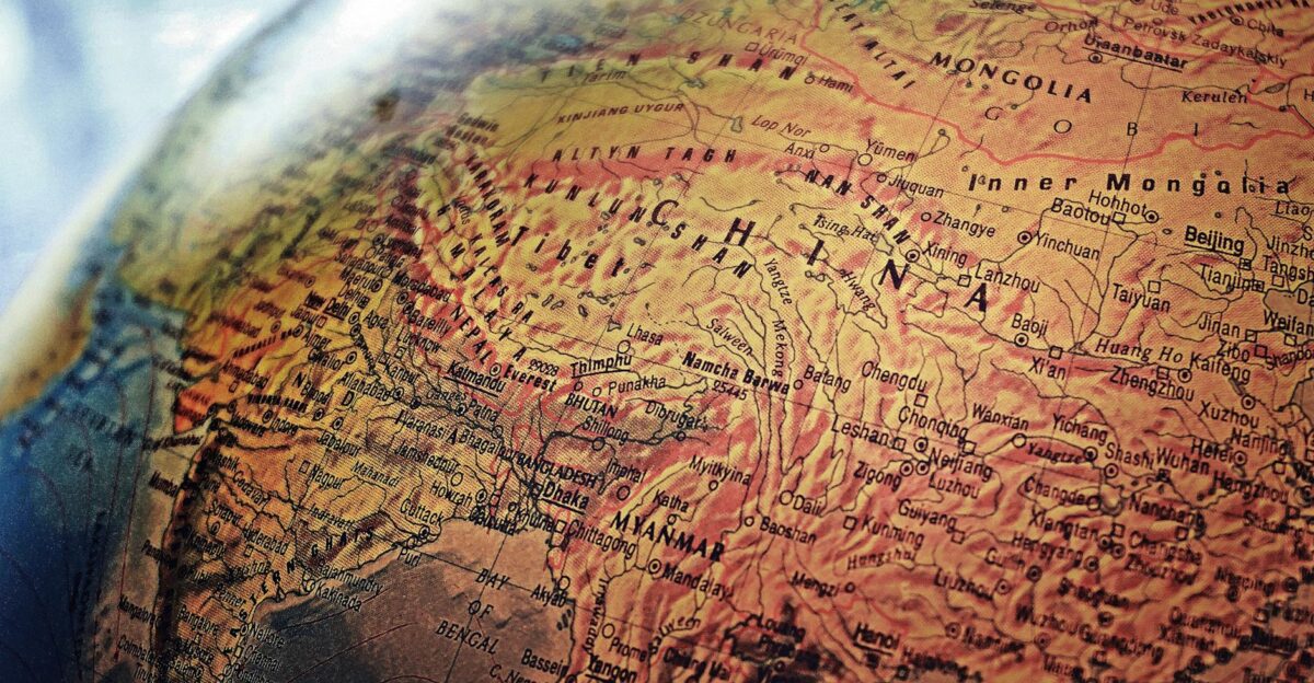 Explore the intricate details of China and neighboring regions in this vintage-style globe photo