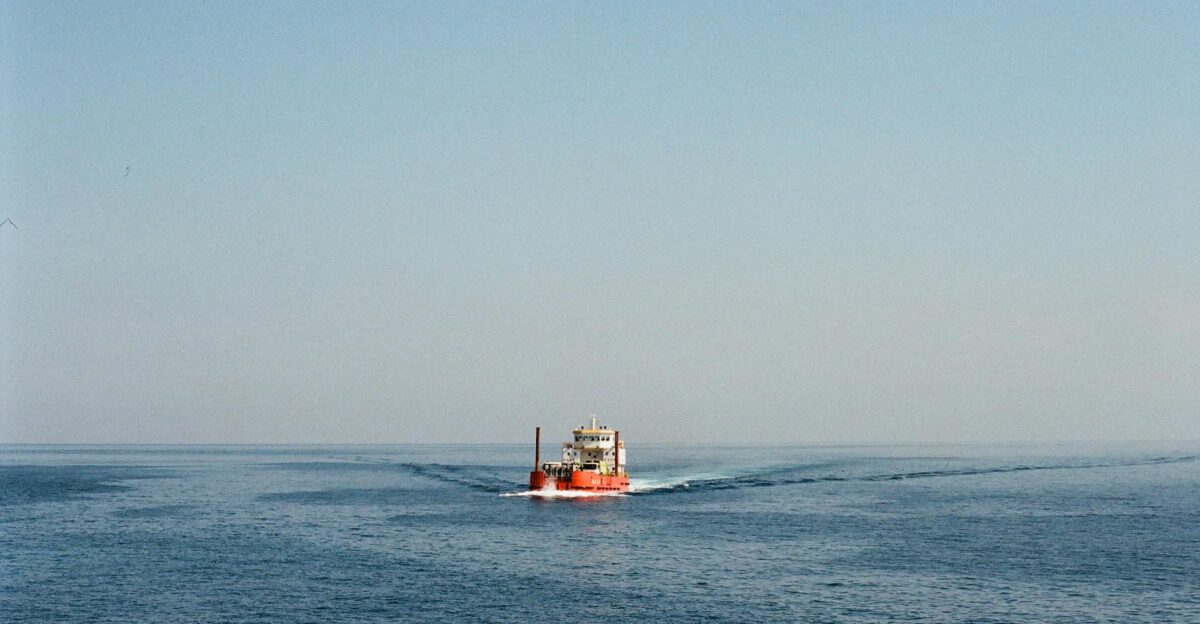 A serene ocean scene with a distant ship and clear sky in Taiwan