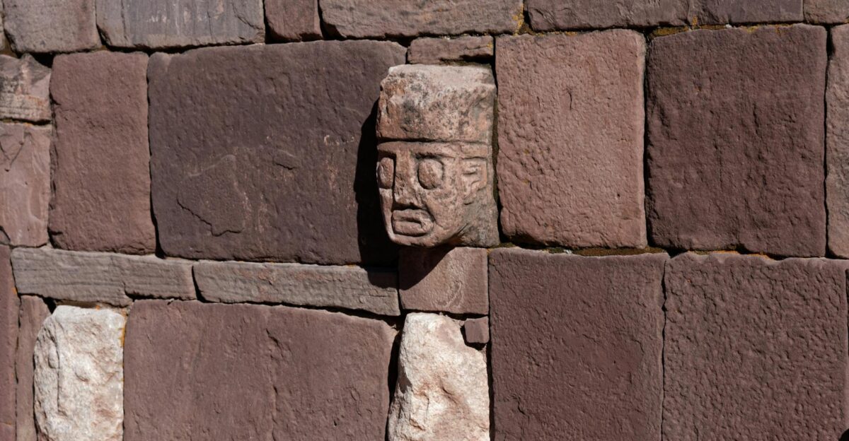 Close-up of carved stone an ancient wall in Tiwanaku Bolivia featuring intricate details