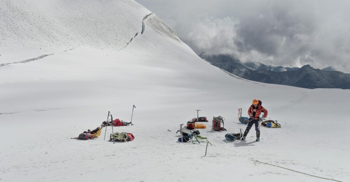 A climber prepares for a high-altitude expedition in the snowy Andes La Paz Bolivia