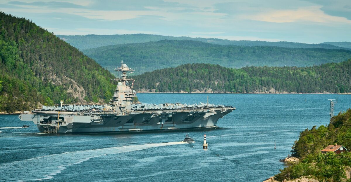 a large military ship in the middle of a body of water