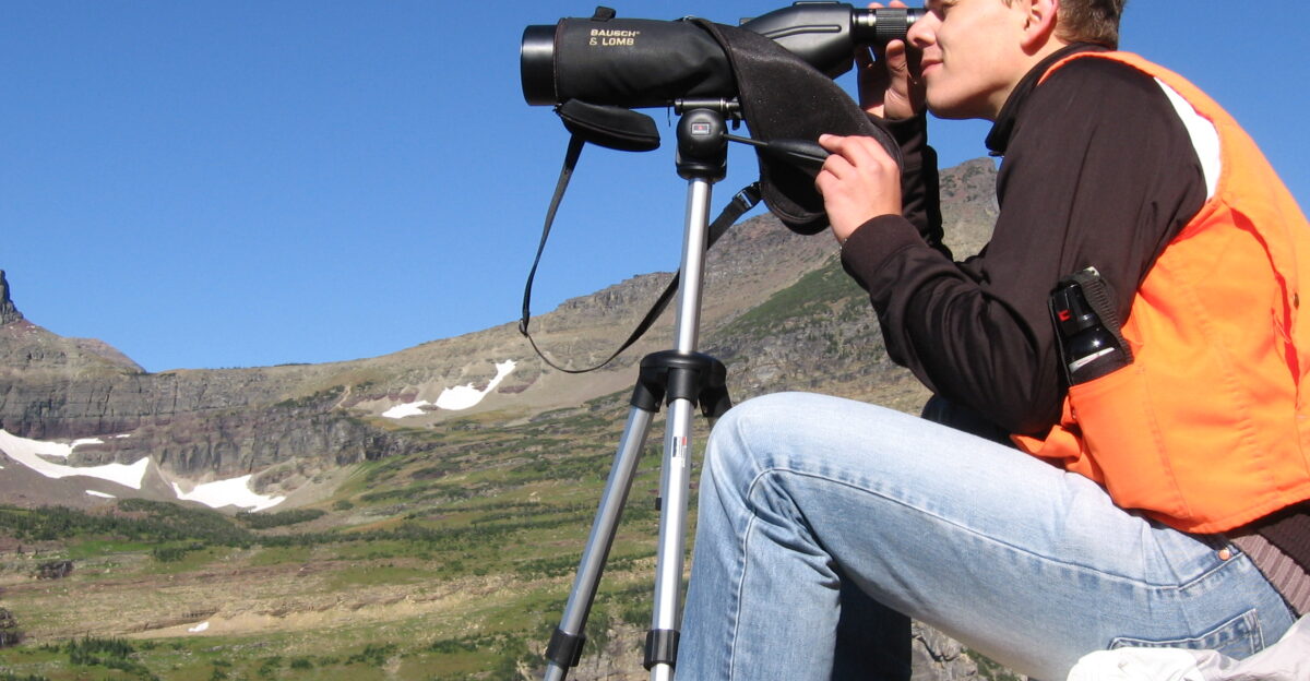 Scanning the cliffs for mountain goats as part of the high country citizen science project