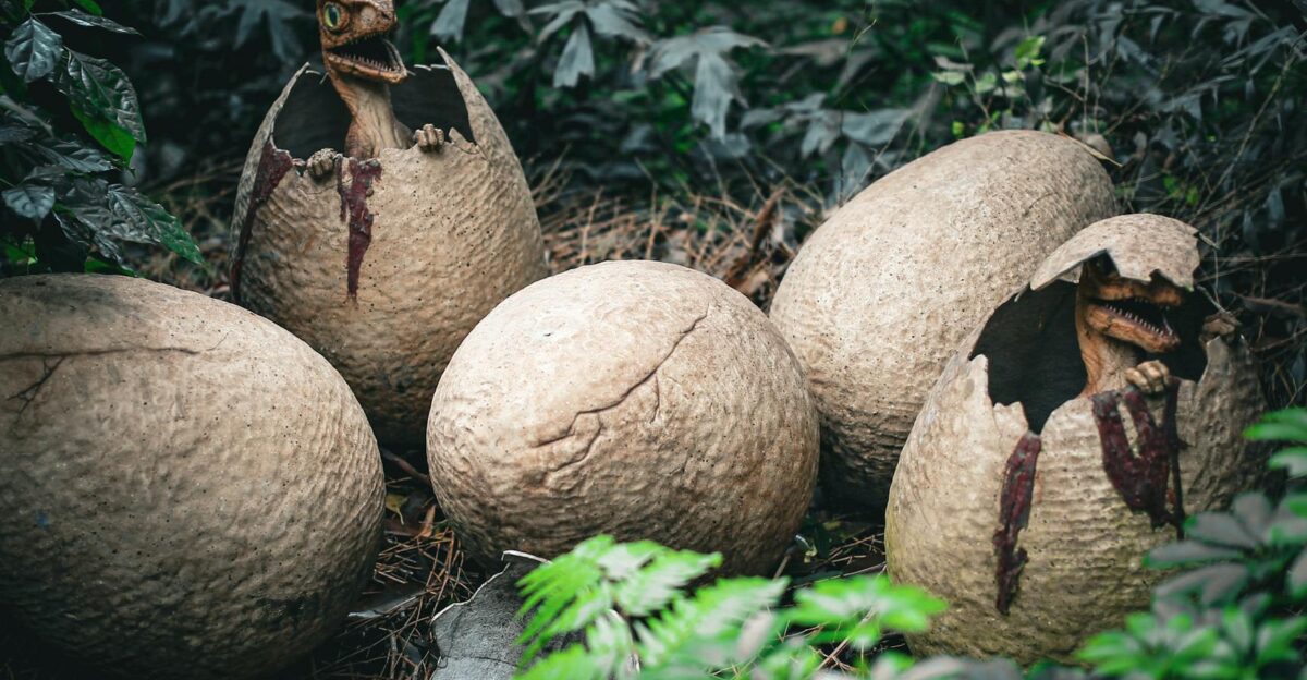 Realistic dinosaur hatchlings emerging from eggs in a lush jungle-like environment
