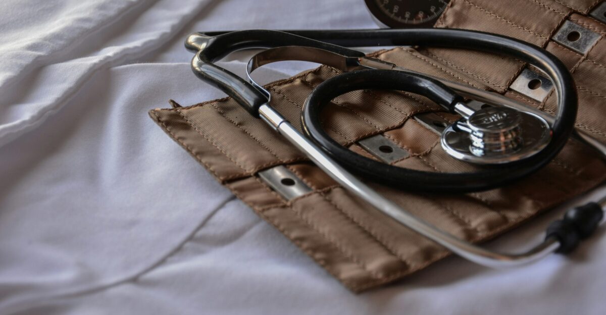 black stethoscope with brown leather case