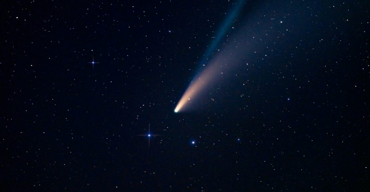 a comet is seen in the night sky