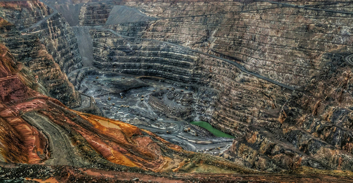 a view of a large open pit in the middle of nowhere