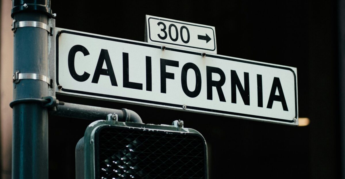 a close up of a street sign with a building in the background